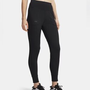 UA Motion Joggers in Black with side pockets. Size L